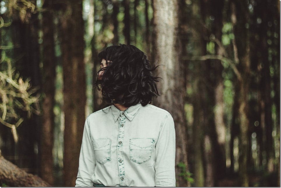 woman-hidden-by-hair-in-nature