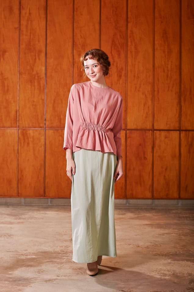 pink ruched waist blouse + green skirt