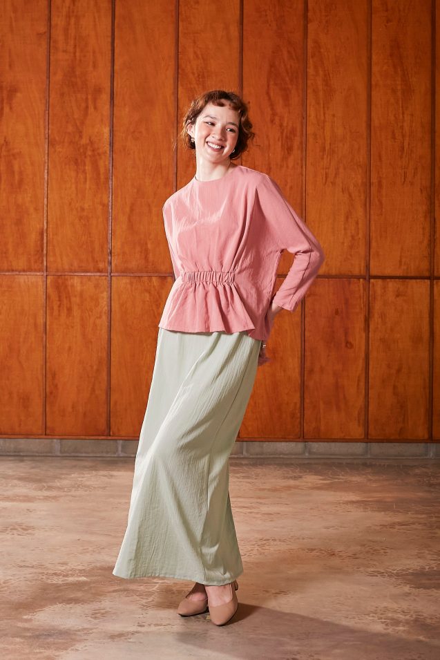 pink ruched waist blouse + green skirt